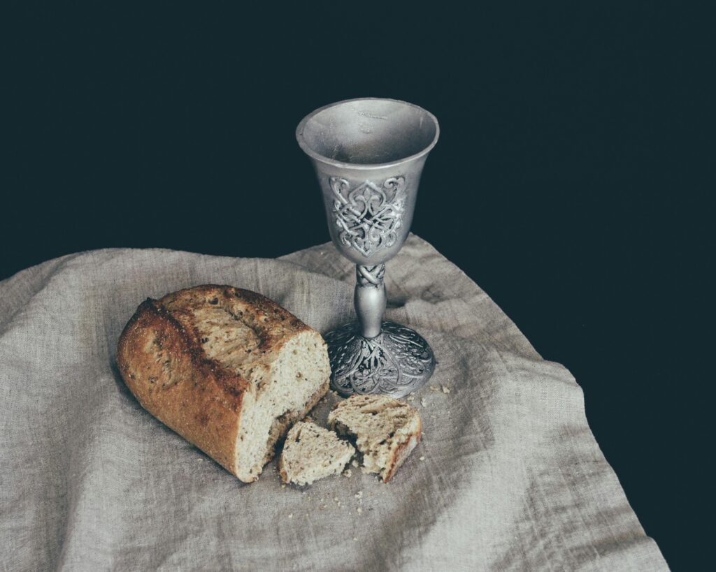 Bread and a chalice on a linen cloth